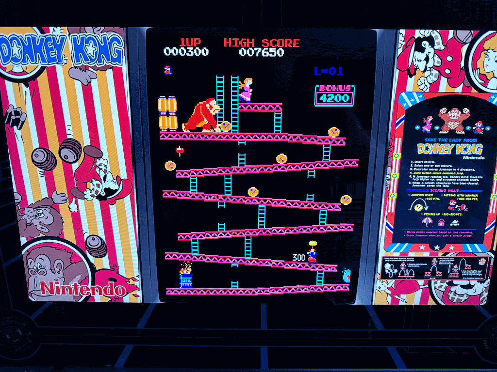 A close up of an arcade playing the Donkey Kong arcade game.