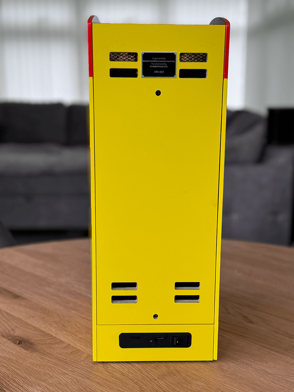 A PAC-MAN Quarter Arcade back view showing the orginal cabinet structure.