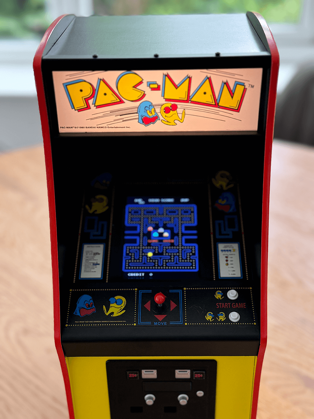 A PAC-MAN Quarter Arcade front view showing the orginal PAC-MAN ROM playing.