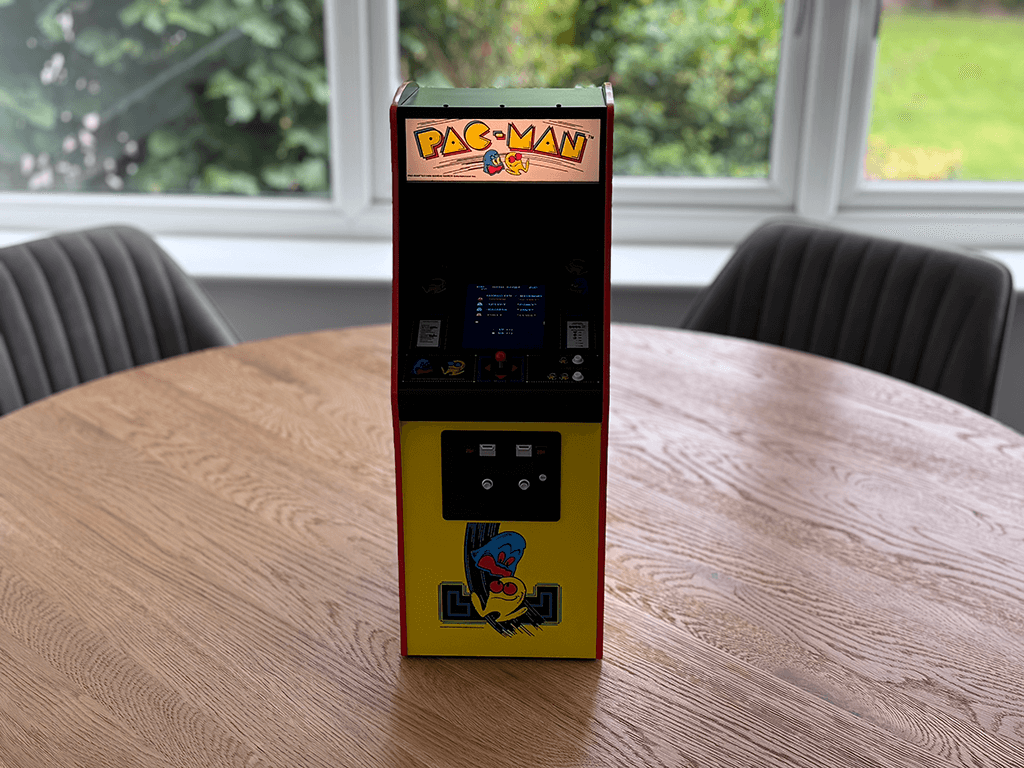 A PAC-MAN Quarter Arcade front view showing the orginal PAC-MAN ROM playing from a distance.