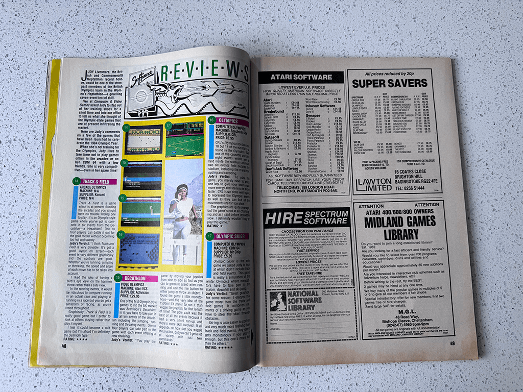 An open 1984 Computer And Video Games magazine from 1984, on the pages are game reviews and adverts.