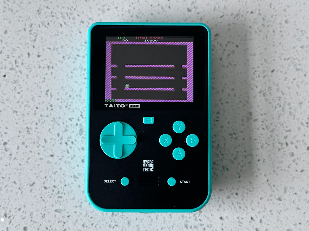 A Taito Super Pocket running Bubble Bobble.