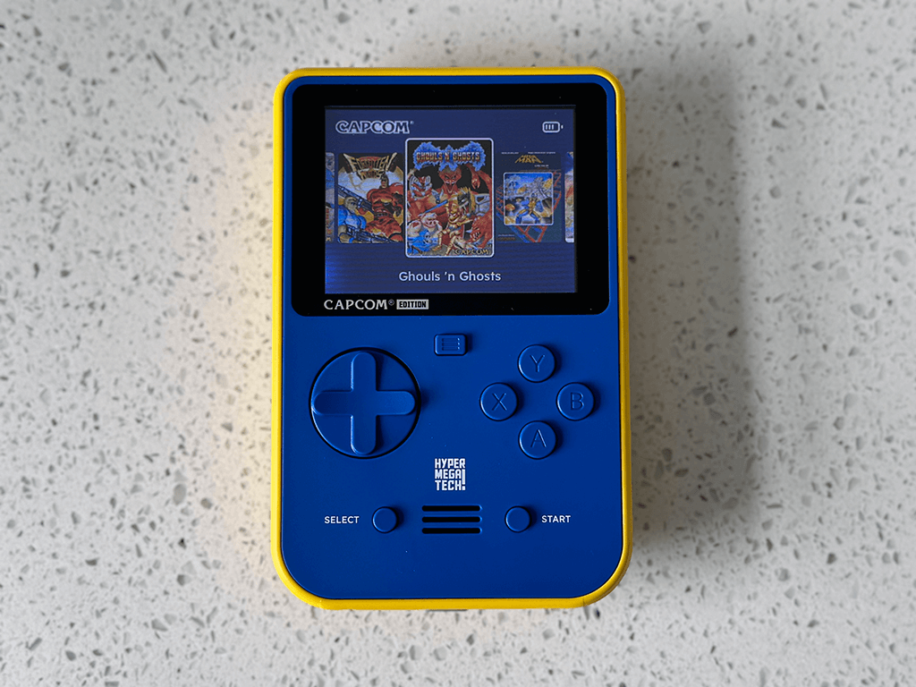 A Capcom Super Pocket running, showing the menu UI which highlights the Ghouls 'n Ghosts game.