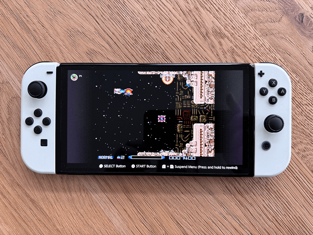 A Nintendo OLED Switch running the R-Type game.